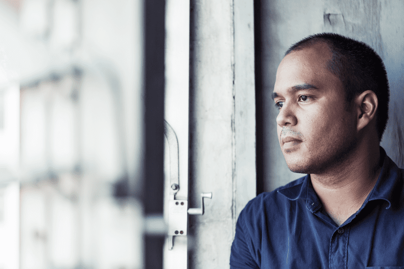 webimage-50E30230-66A0-4B4A-8133A514083E0A2B Man staring pensively out a window.